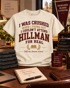 Cream Hillman Alum statement T-shirt reading I Was Crushed When I Found Out I Couldn't Attend Hillman for Real